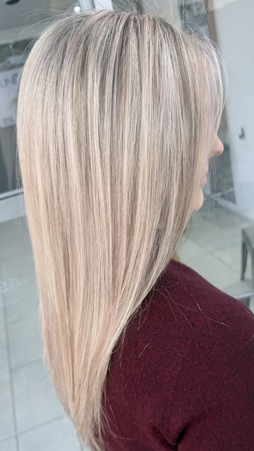 Long smooth blonde hair with delicate dimension